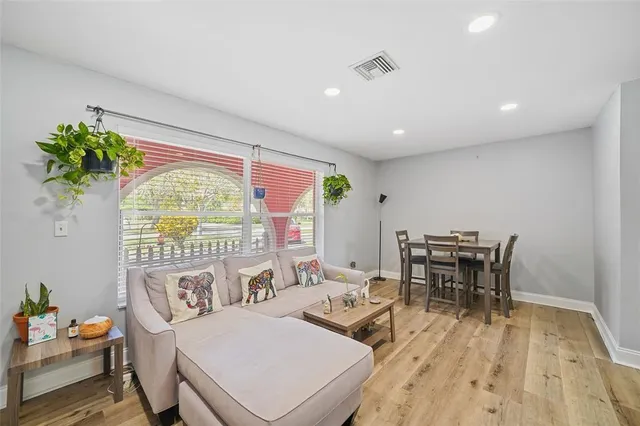 a living room with furniture and a table