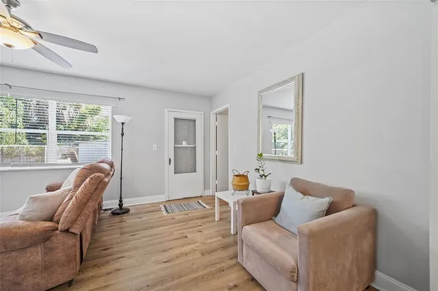 a living room with furniture and a window