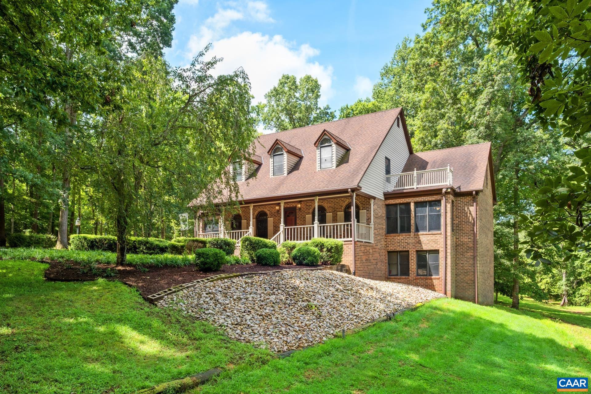 a view of a house with a yard and plants