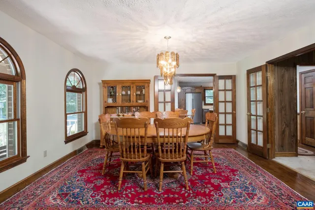 a view of front door of house with large window