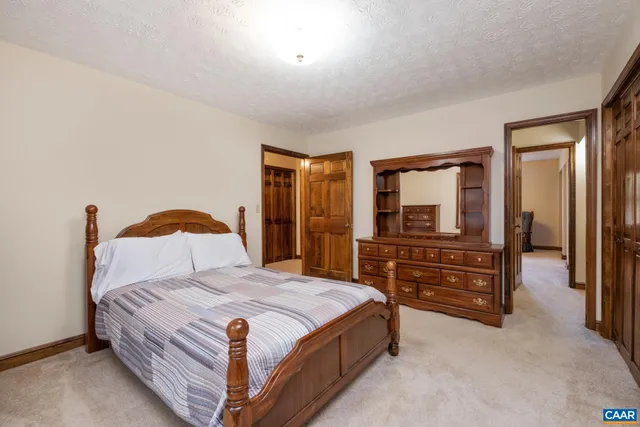 a bedroom with a bed and furniture