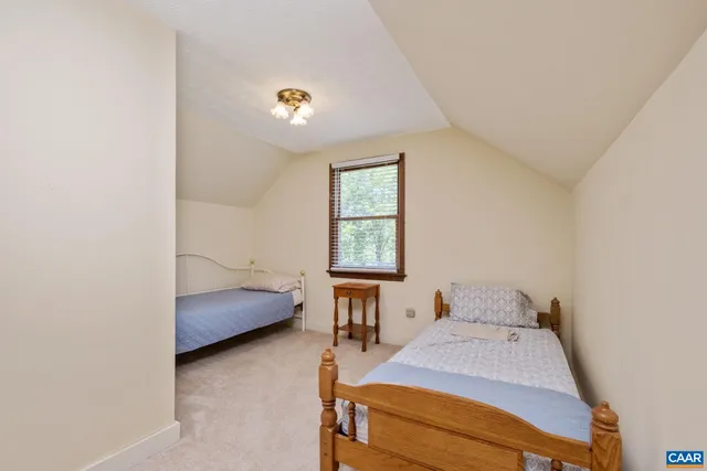 a room with pool table and windows