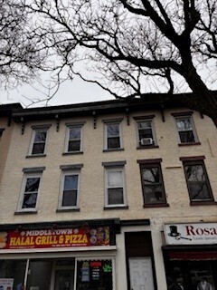 570 Main Street, Unit 3 Middletown, CT 06457 - Photo 1 of 8 a front view of a building with many windows