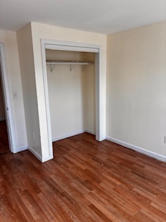 570 Main Street, Unit 3 Middletown, CT 06457 - Photo 3 of 8 a view of empty room with wooden floor and closet