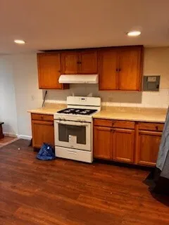 a kitchen with a stove and a microwave