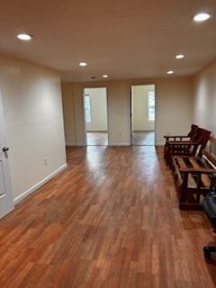570 Main Street, Unit 3 Middletown, CT 06457 - Photo 7 of 8 an empty room with wooden floor and windows
