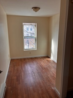 570 Main Street, Unit 3 Middletown, CT 06457 - Photo 8 of 8 an empty room with wooden floor and windows