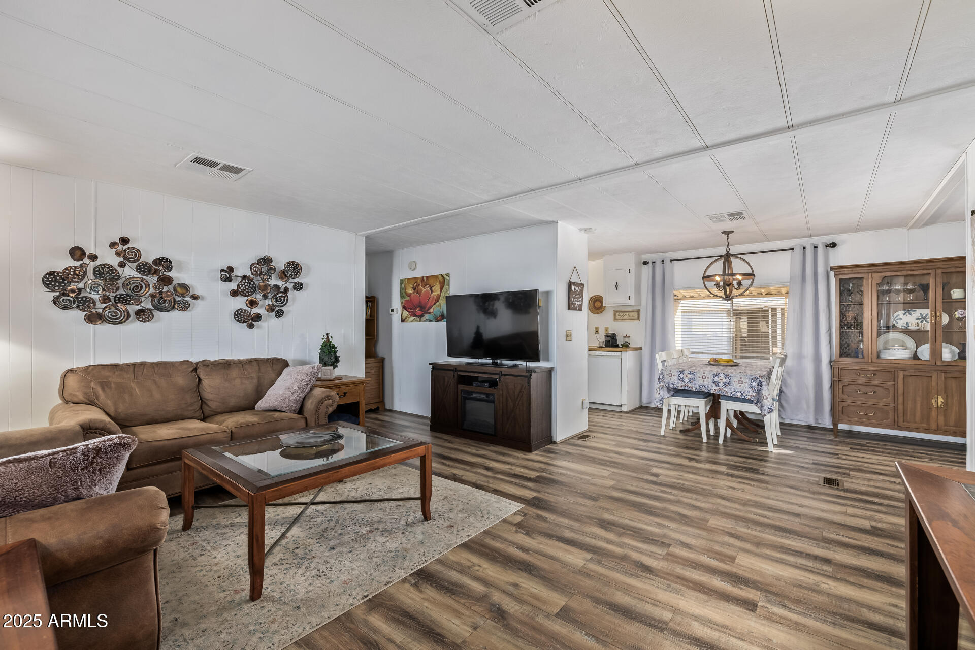 11425 East University Drive, Unit 120 Apache Junction, AZ 85120 - Photo 1 of 43 a living room with furniture and a flat screen tv