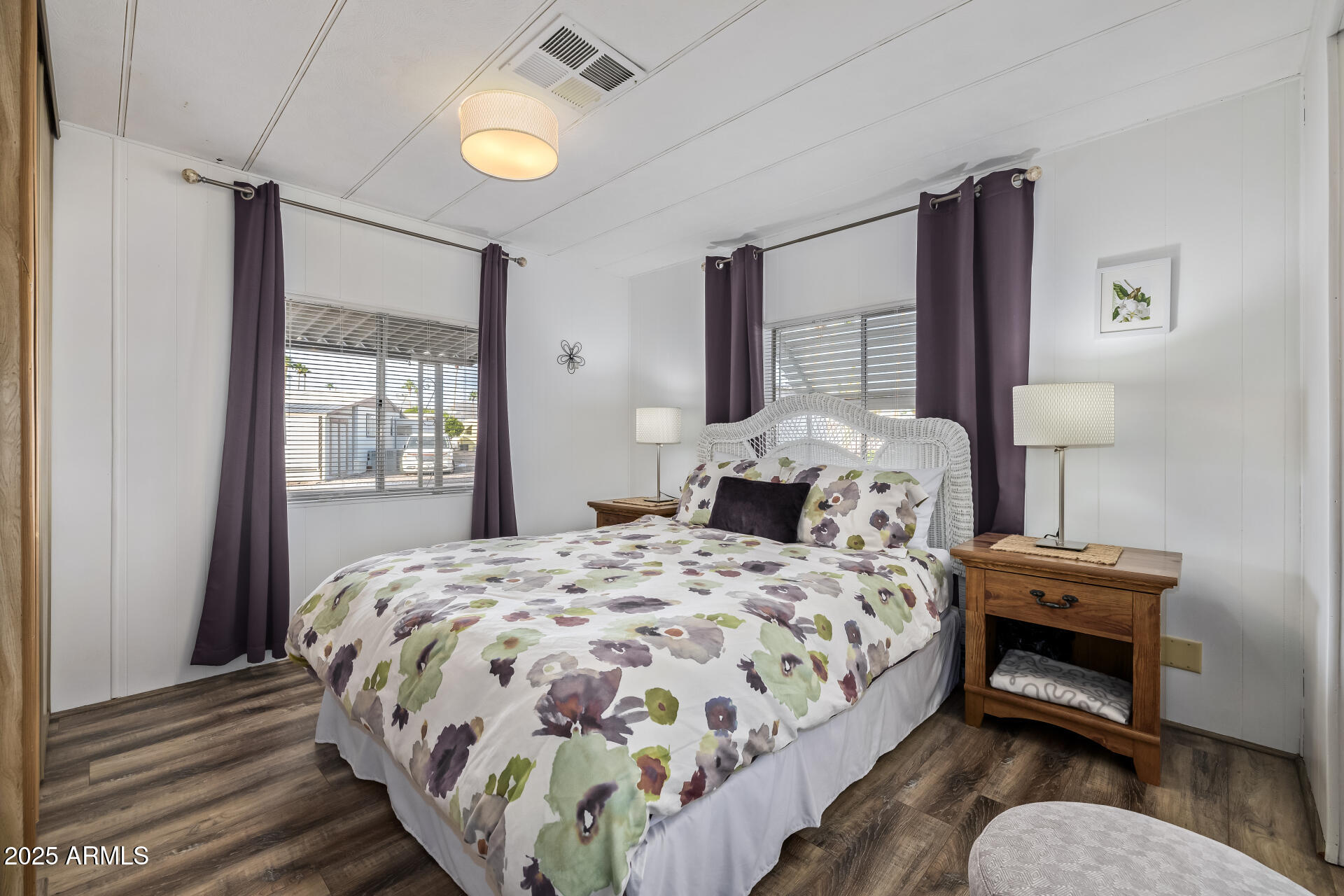 11425 East University Drive, Unit 120 Apache Junction, AZ 85120 - Photo 12 of 43 a bedroom with a bed and wooden floor