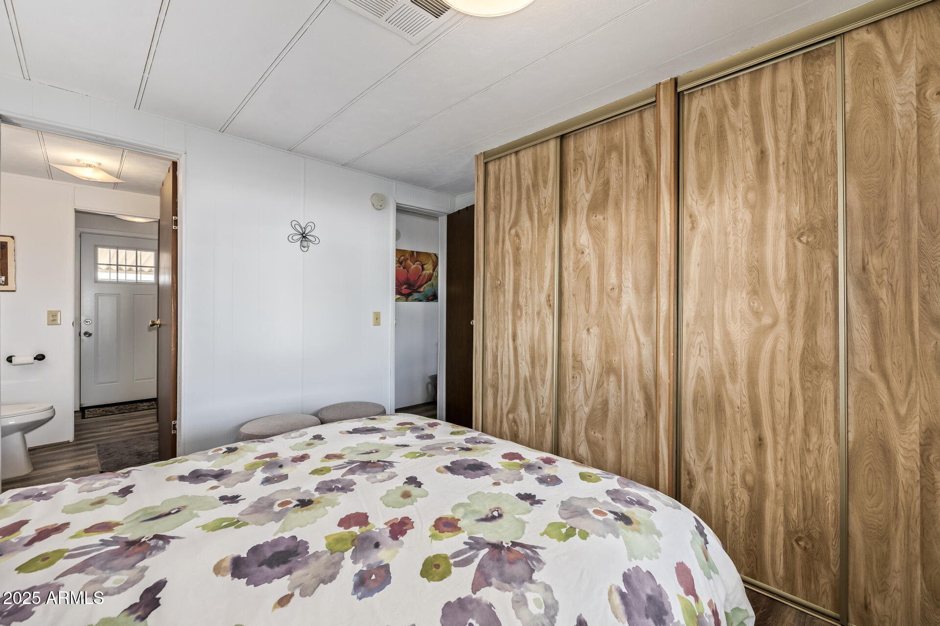 11425 East University Drive, Unit 120 Apache Junction, AZ 85120 - Photo 13 of 43 a bedroom with a bed and a curtain