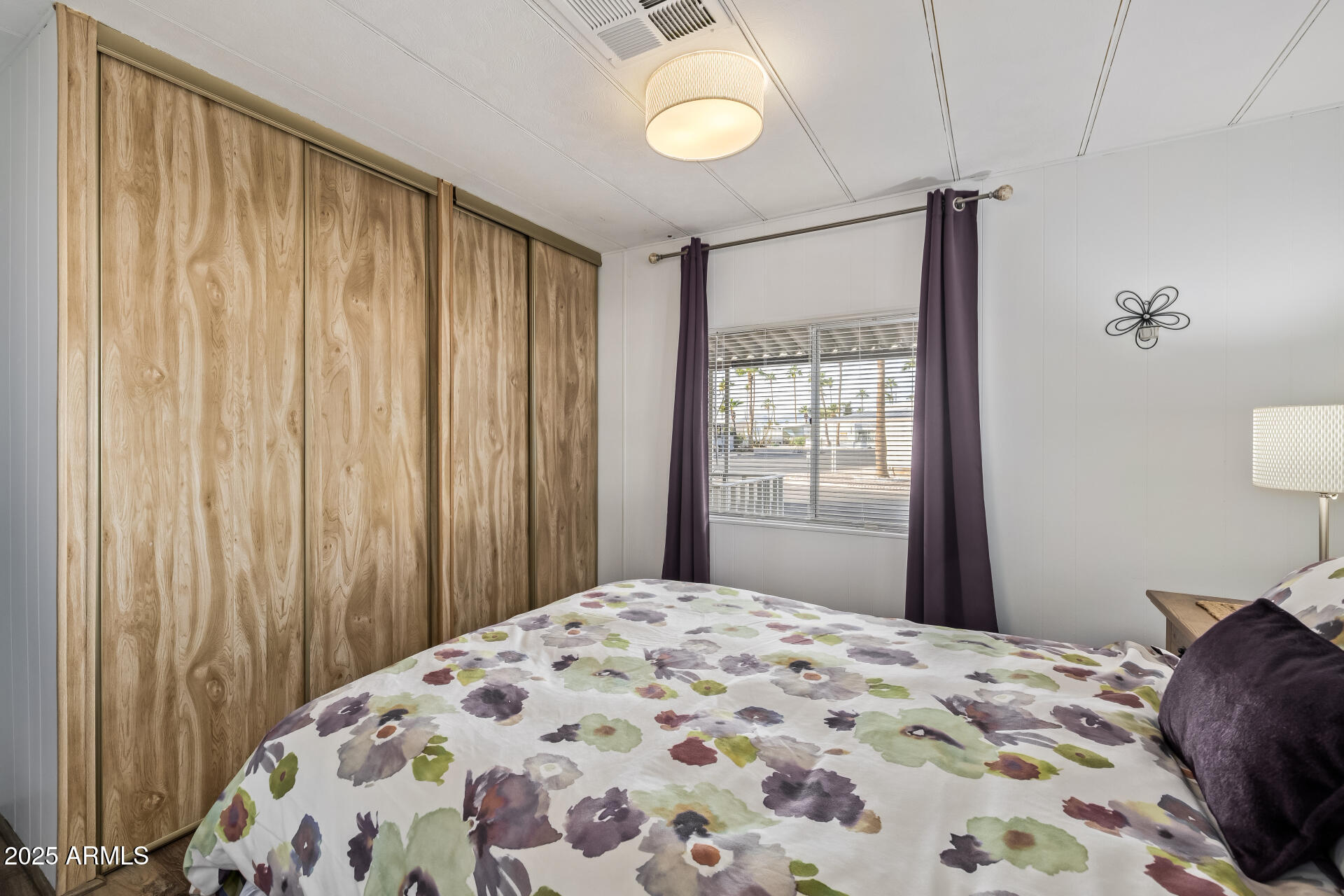 11425 East University Drive, Unit 120 Apache Junction, AZ 85120 - Photo 14 of 43 a bedroom with a bed and a window