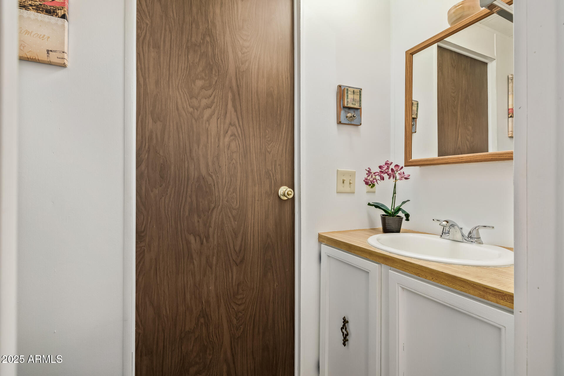11425 East University Drive, Unit 120 Apache Junction, AZ 85120 - Photo 15 of 43 a bathroom with a sink and a mirror