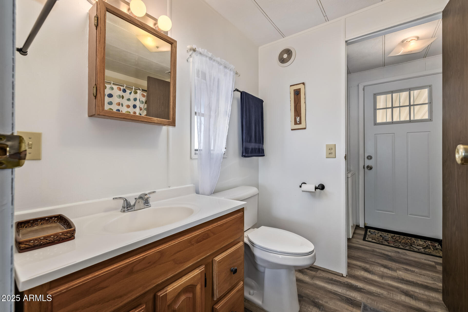 11425 East University Drive, Unit 120 Apache Junction, AZ 85120 - Photo 19 of 43 a bathroom with a sink a toilet and shower