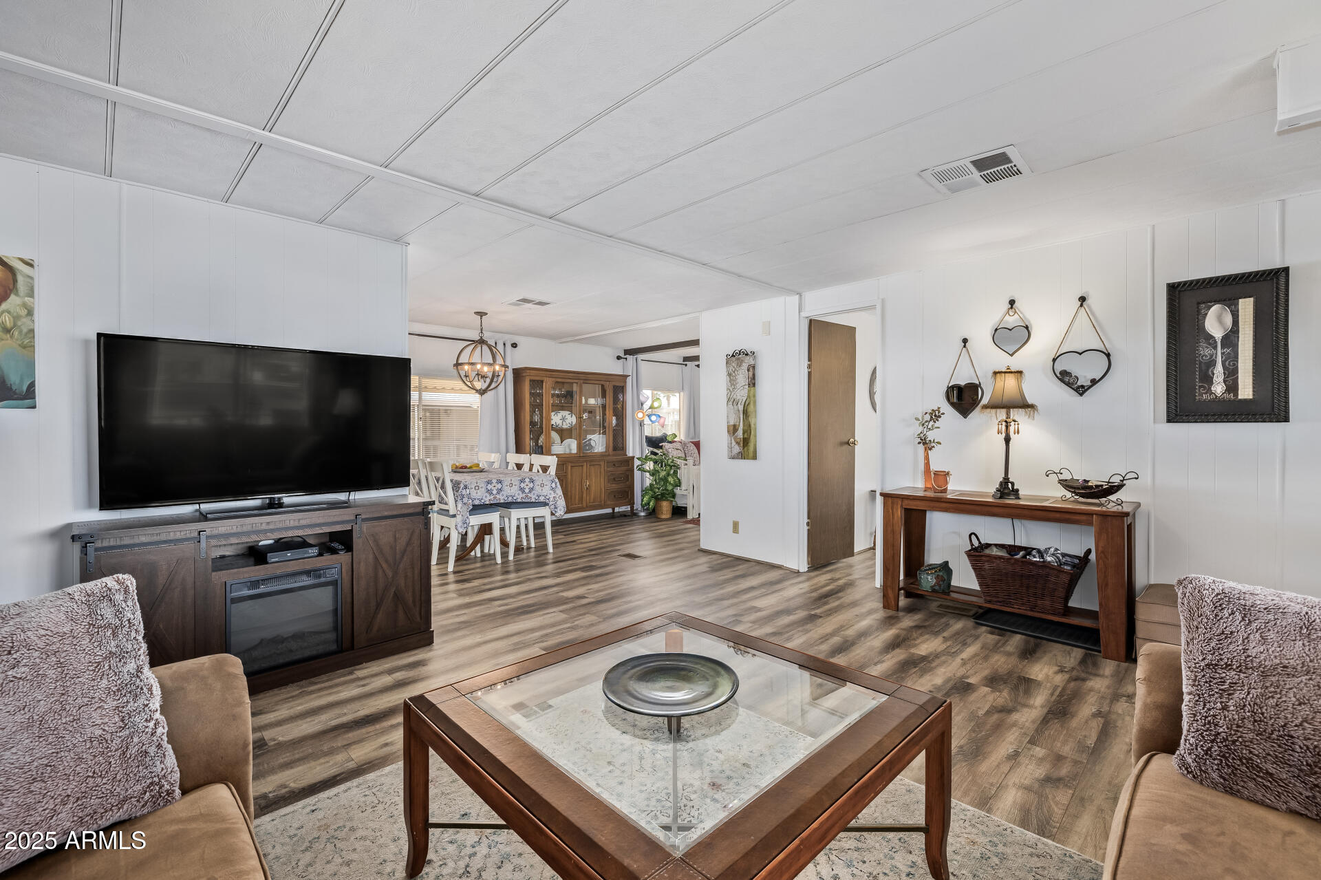11425 East University Drive, Unit 120 Apache Junction, AZ 85120 - Photo 2 of 43 a living room with furniture and a flat screen tv