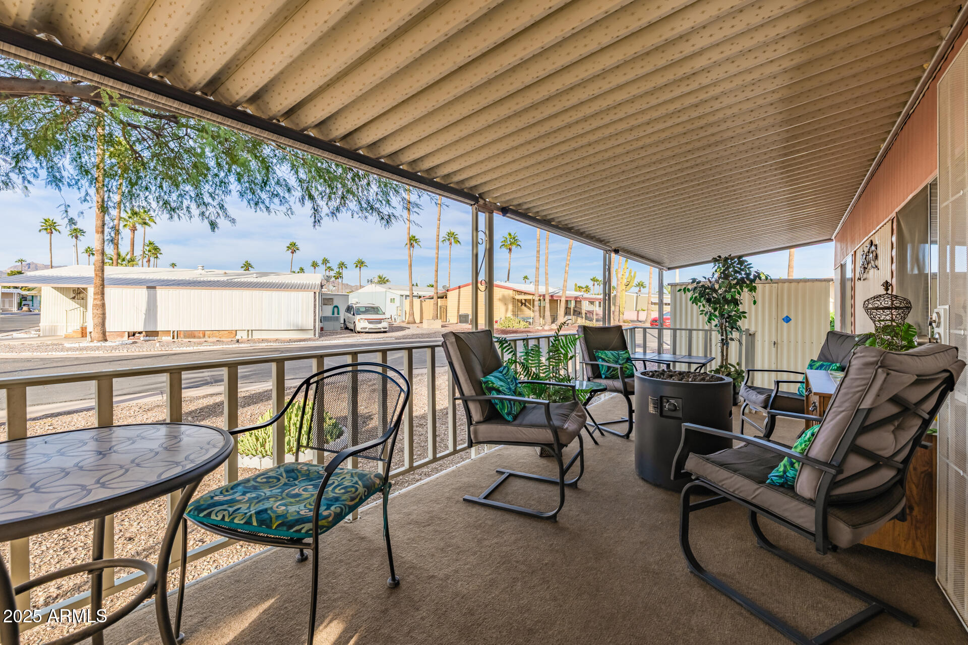11425 East University Drive, Unit 120 Apache Junction, AZ 85120 - Photo 21 of 43 a balcony with furniture and outdoor view