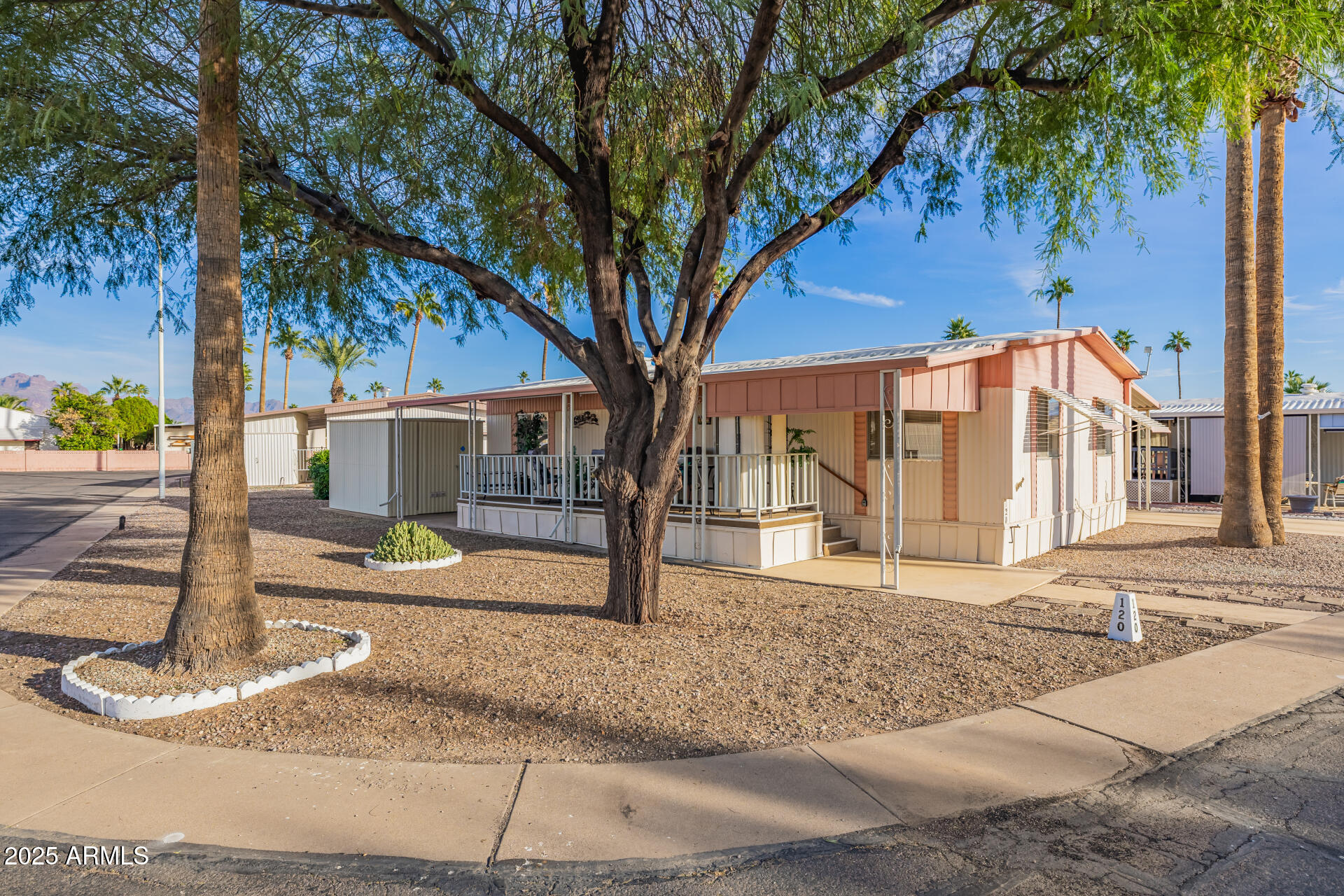 11425 East University Drive, Unit 120 Apache Junction, AZ 85120 - Photo 26 of 43 a view of a house with street next to a road