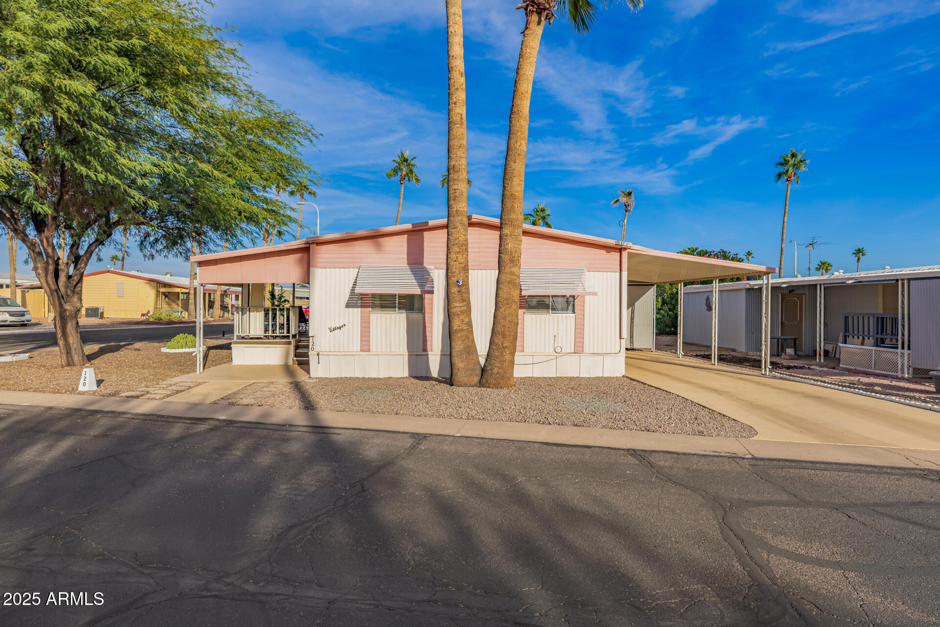 11425 East University Drive, Unit 120 Apache Junction, AZ 85120 - Photo 29 of 43 a view of a house with a street
