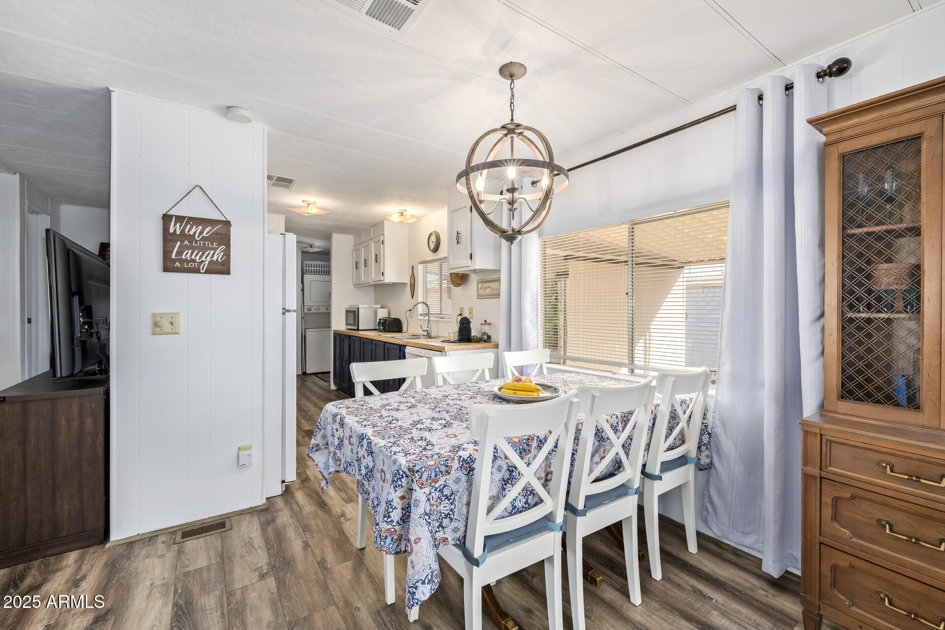 11425 East University Drive, Unit 120 Apache Junction, AZ 85120 - Photo 4 of 43 a view of a dining room with furniture window and wooden floor