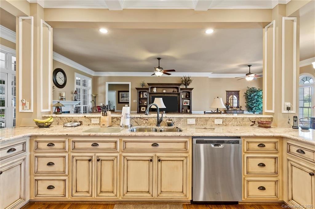 1125 Snyders Store Road Wingate, NC 28174 - Photo 14 of 48 a kitchen with cabinets appliances and a counter