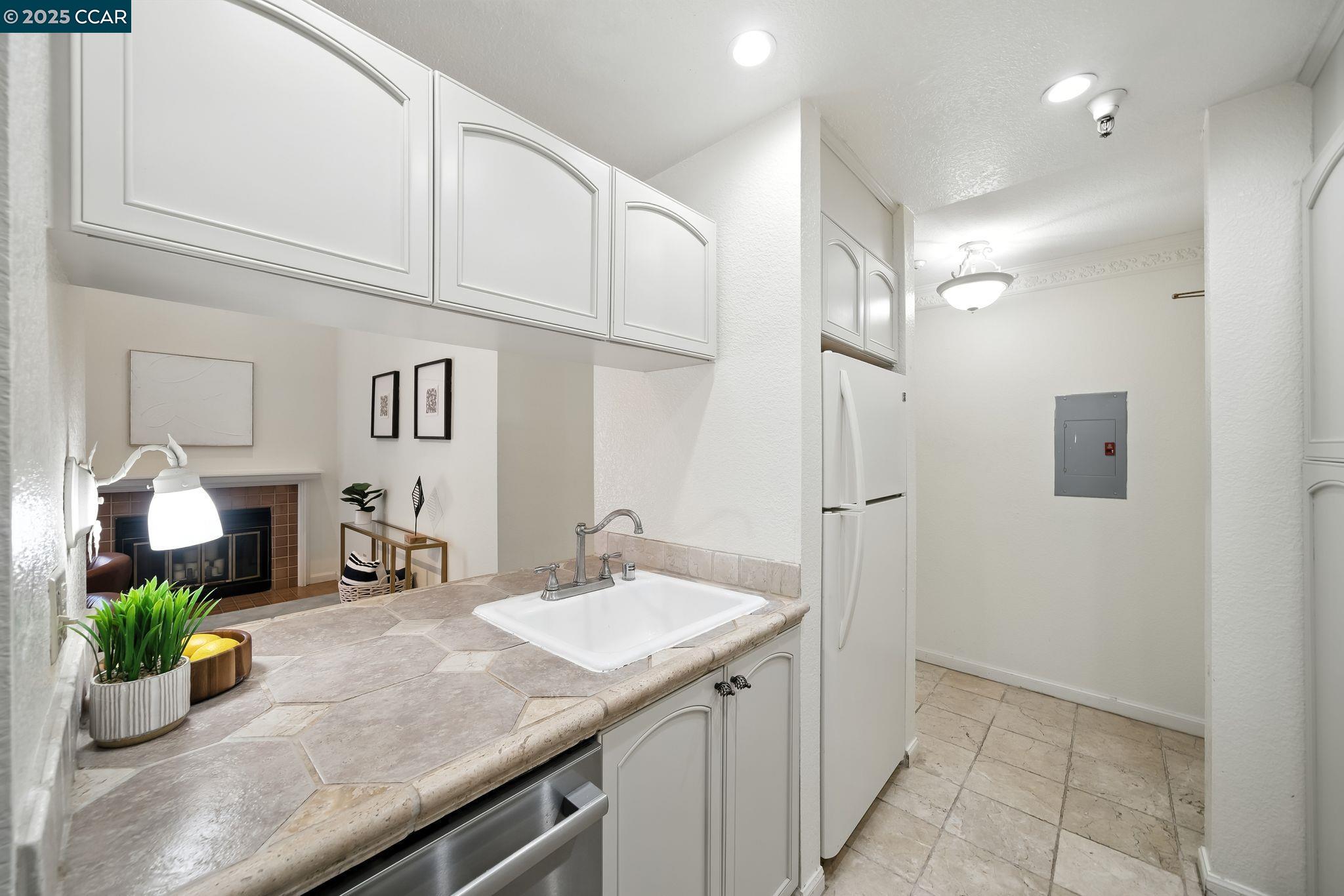 3183 Wayside Plaza, Unit 320 Walnut Creek, CA 94597 - Photo 12 of 34 a bathroom with a sink a vanity and a mirror