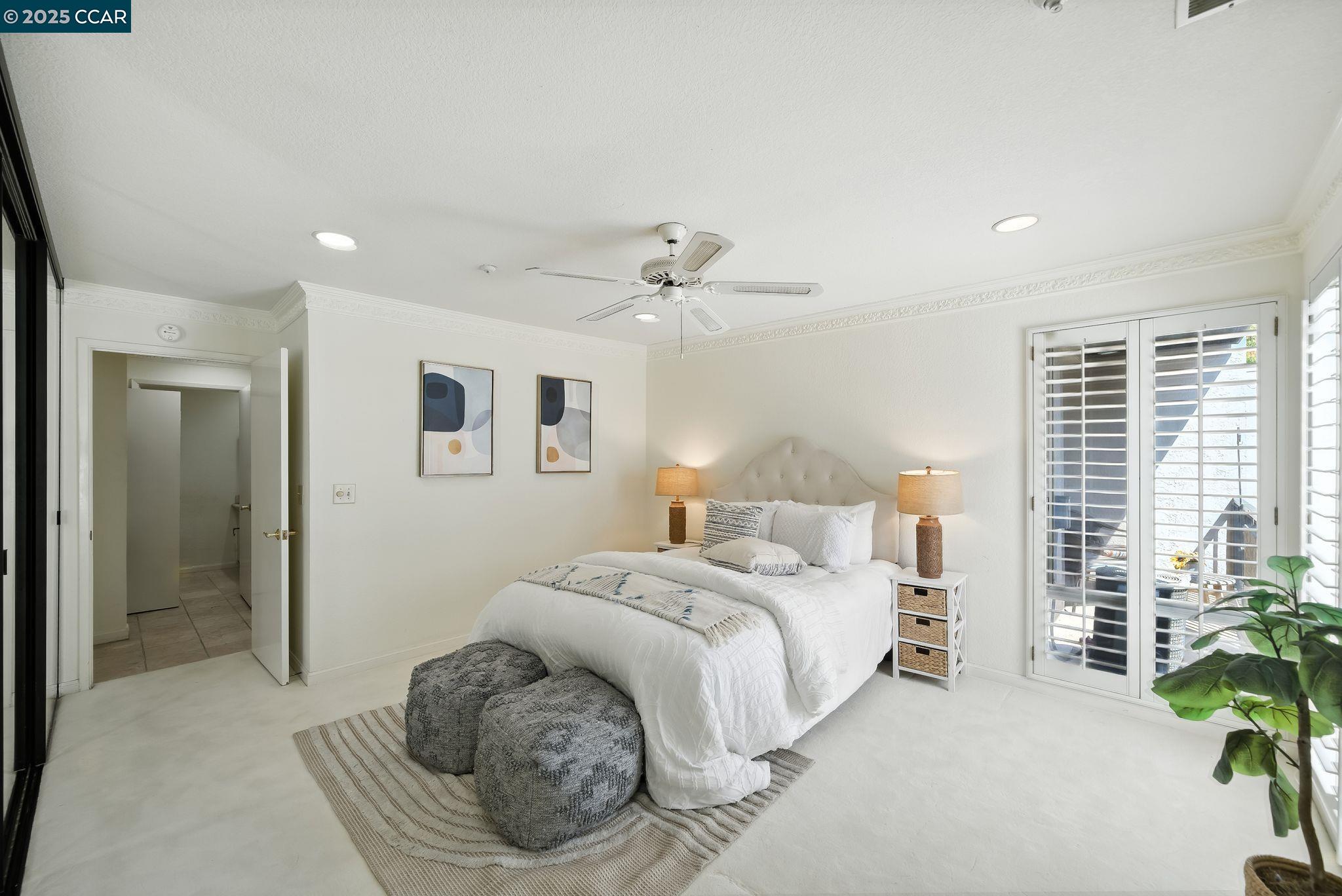 3183 Wayside Plaza, Unit 320 Walnut Creek, CA 94597 - Photo 18 of 34 a spacious bedroom with a bed and a chandelier