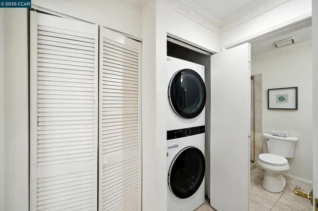 a view of a hallway with washer and dryer