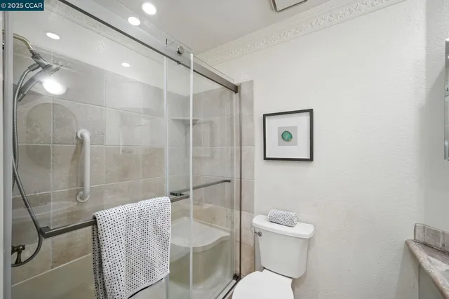 a bathroom with a toilet sink and shower