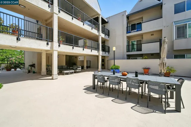 a view of a building with sitting area