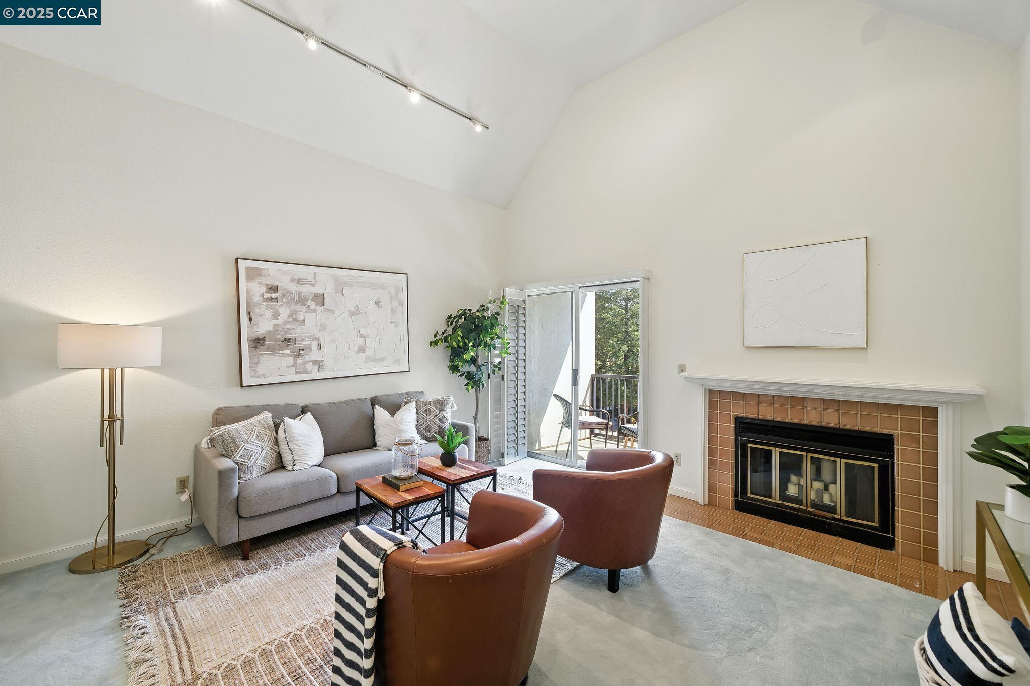 3183 Wayside Plaza, Unit 320 Walnut Creek, CA 94597 - Photo 3 of 34 a living room with furniture and a fireplace