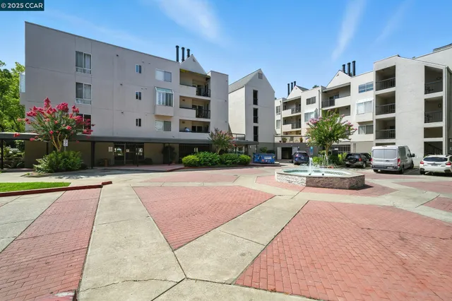 a view of a building with a yard