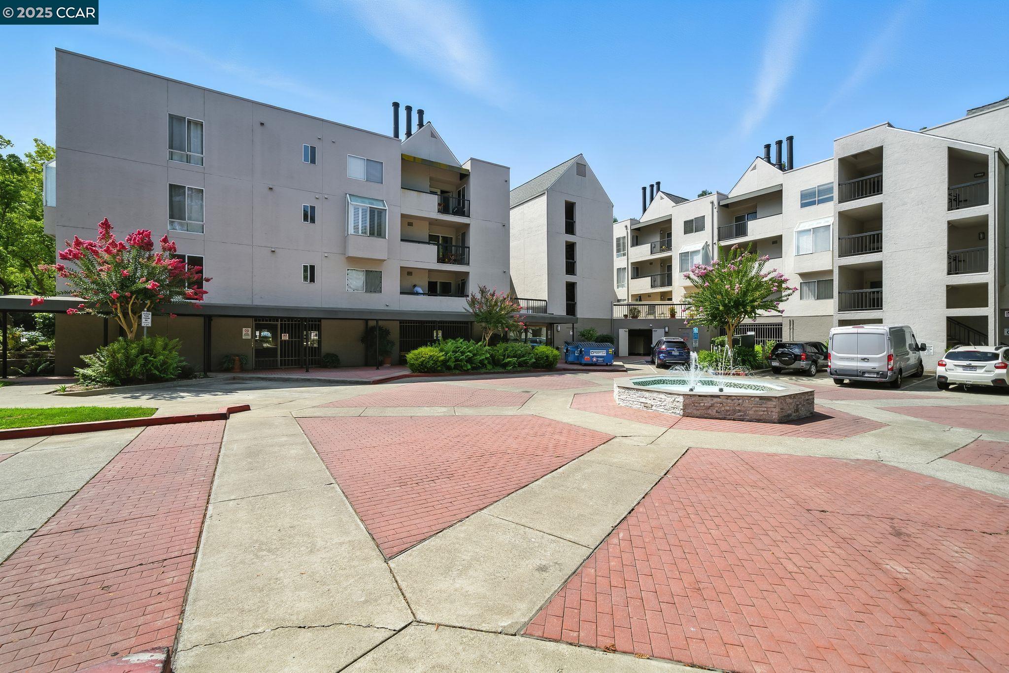 3183 Wayside Plaza, Unit 320 Walnut Creek, CA 94597 - Photo 32 of 34 a view of a building with a yard