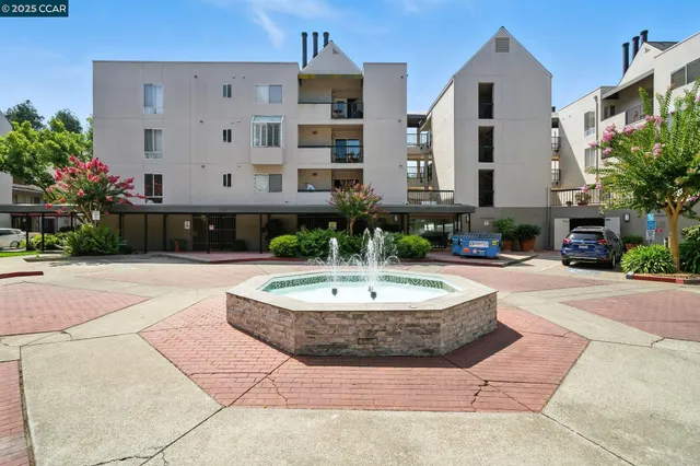 a building with potted plants in front of it