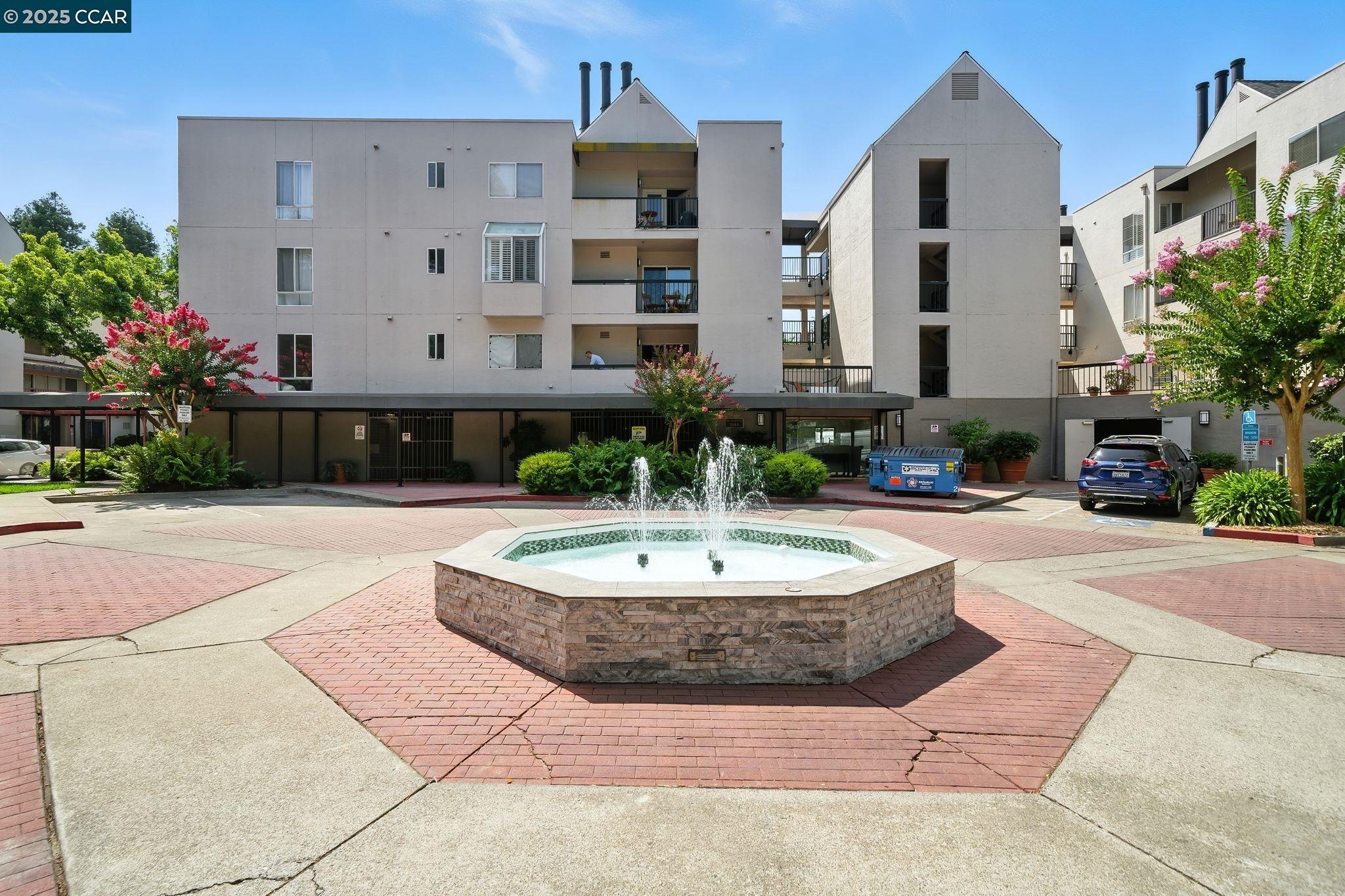 3183 Wayside Plaza, Unit 320 Walnut Creek, CA 94597 - Photo 33 of 34 a building with potted plants in front of it