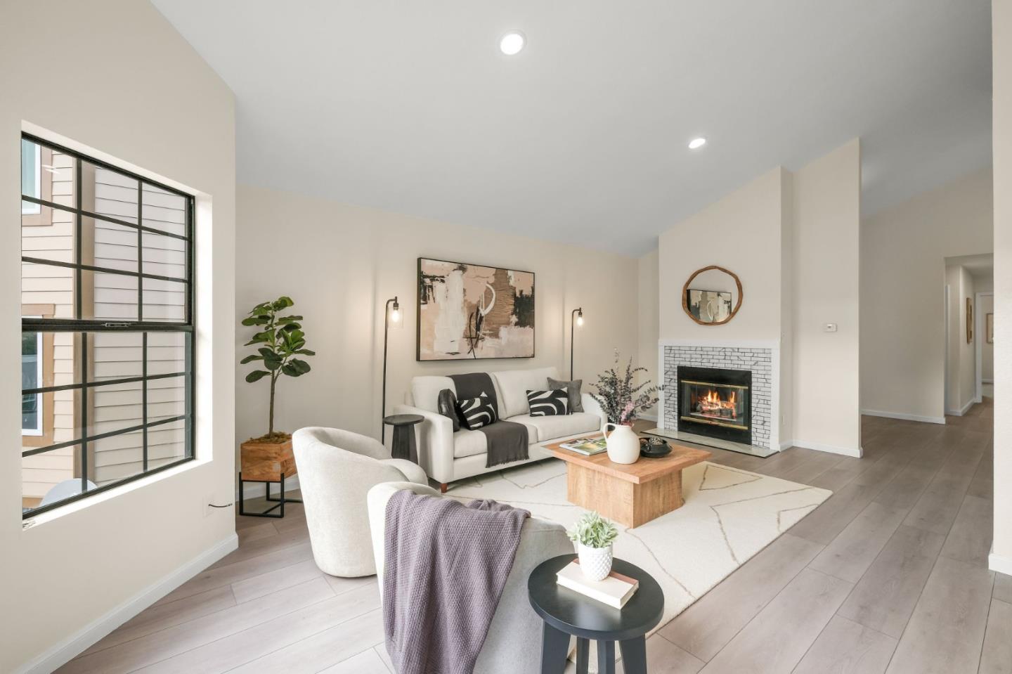415 C Street Colma, CA 94014 - Photo 11 of 57 a living room with furniture a fireplace and a large window