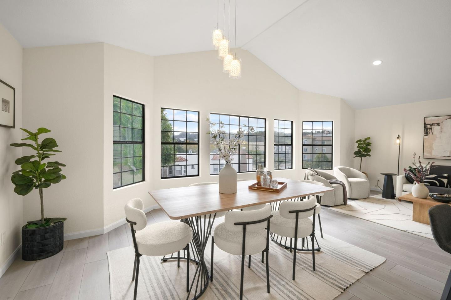 415 C Street Colma, CA 94014 - Photo 13 of 57 a dining room with furniture potted plants and a potted plant