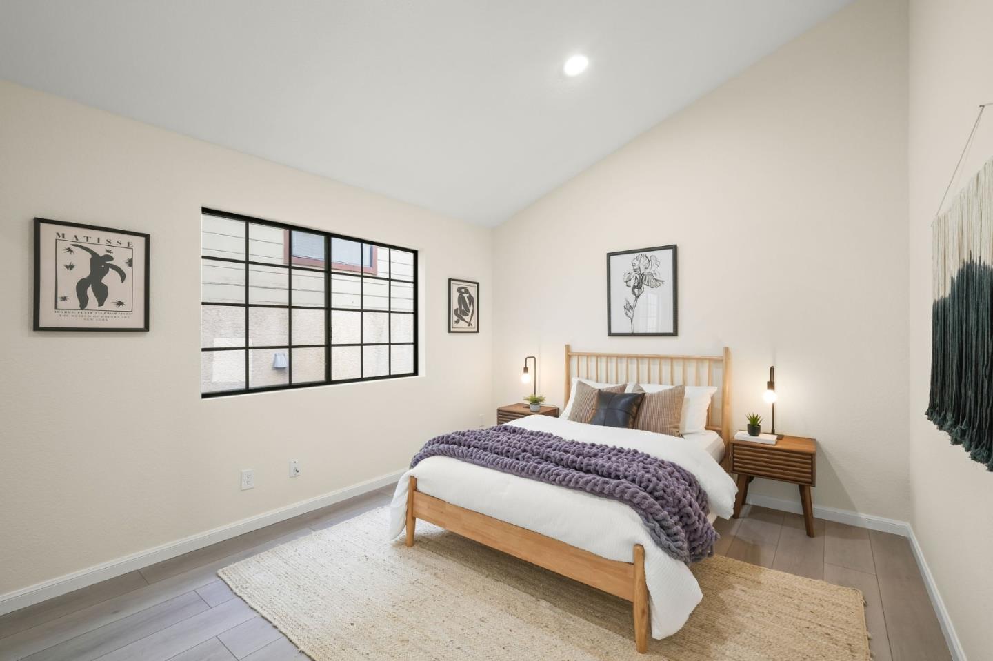 415 C Street Colma, CA 94014 - Photo 21 of 57 a bedroom with a bed a painting on the wall and a window