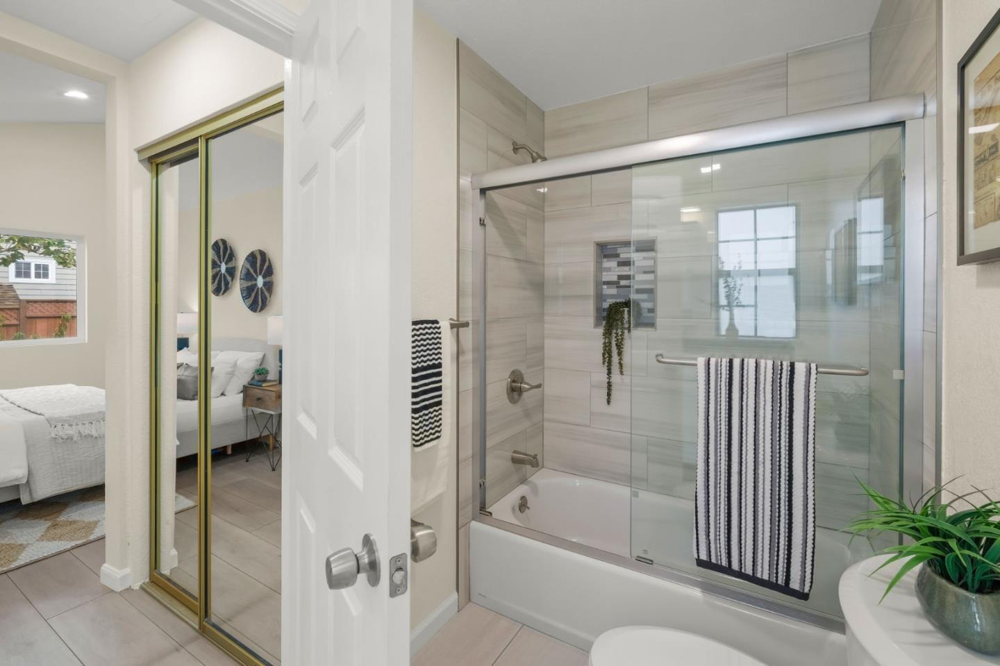 415 C Street Colma, CA 94014 - Photo 31 of 57 a bathroom with a tub shower and a sink