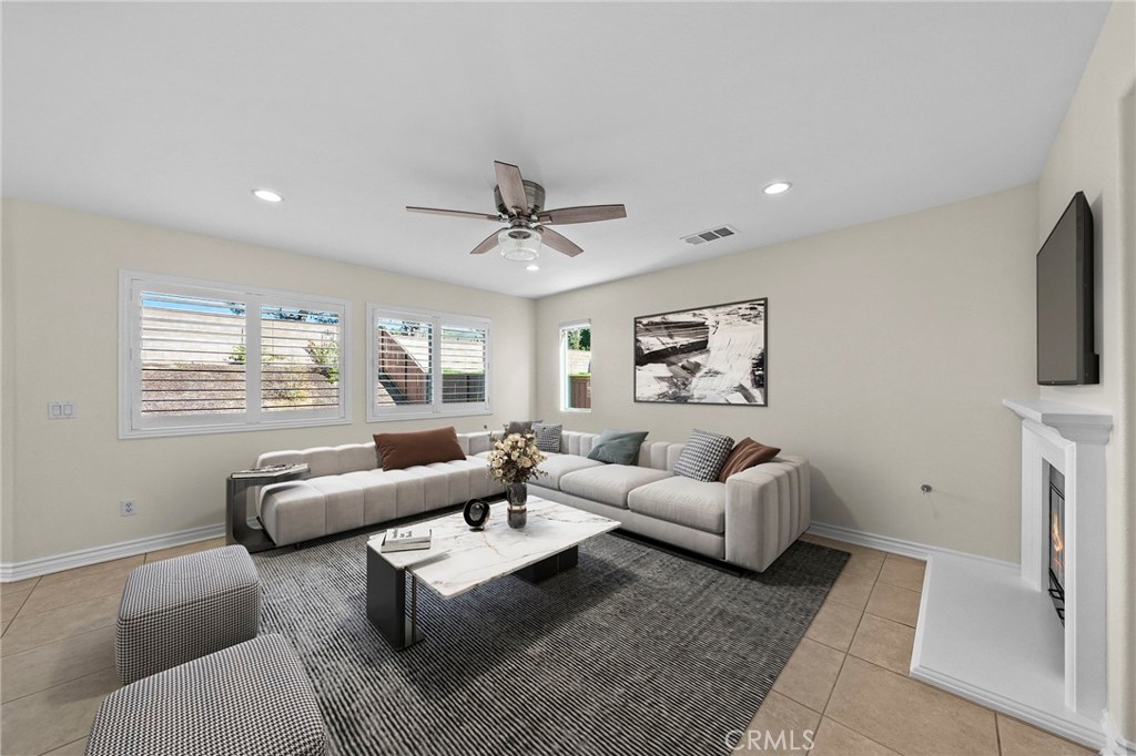11344 Magnolia Street Corona, CA 92883 - Photo 12 of 75 a living room with furniture and a window