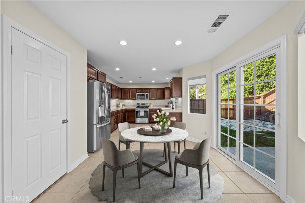 11344 Magnolia Street Corona, CA 92883 - Photo 18 of 75 a view of a dining room with furniture window and outside view