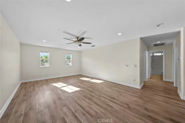 a bathroom with a granite countertop sink a vanity and a shower