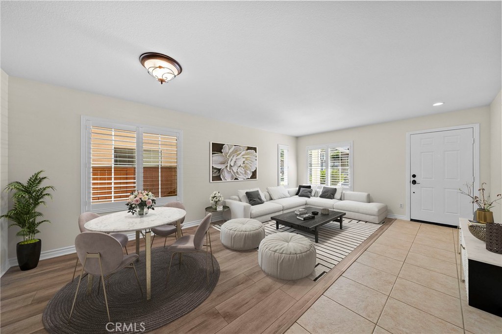 11344 Magnolia Street Corona, CA 92883 - Photo 8 of 75 a living room with furniture and a large window