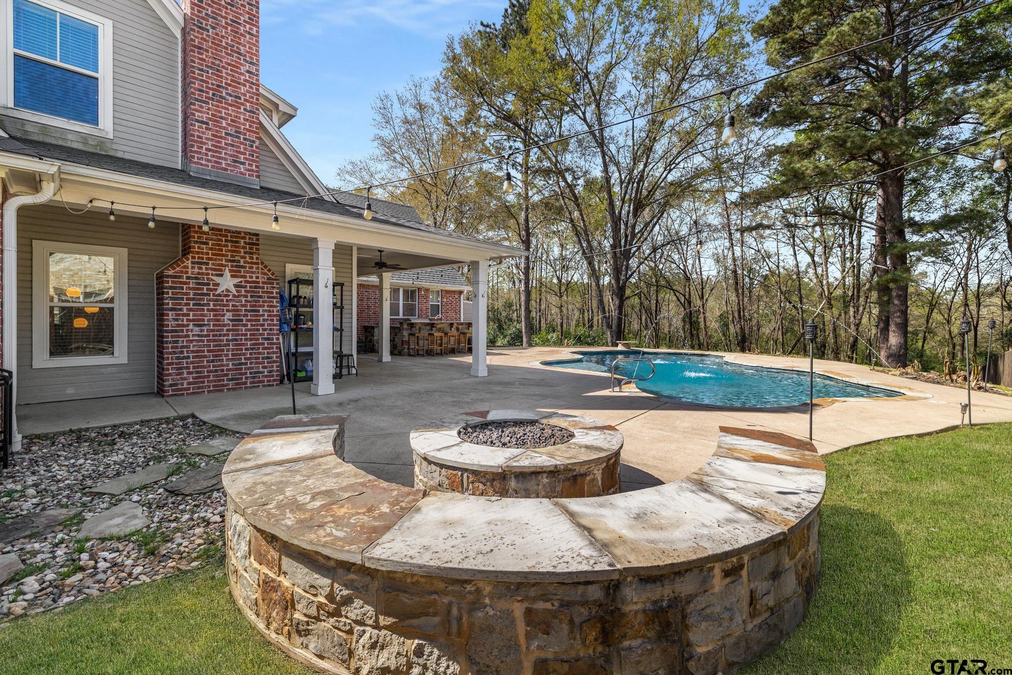 9453 Cherokee Trail Tyler, TX 75703 - Photo 34 of 40 a view of a house with swimming pool