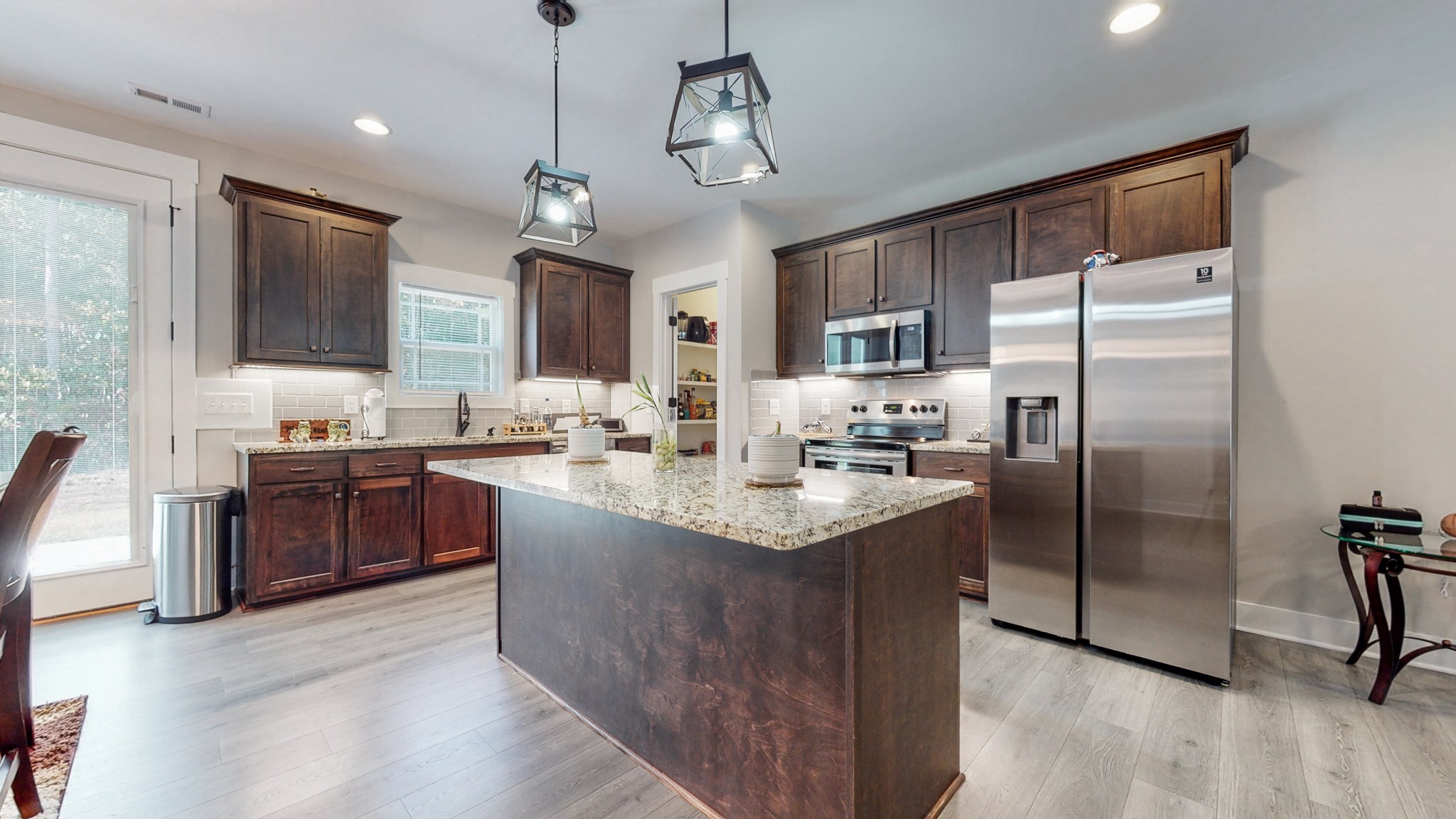 2620 Wayside Road Manchester, TN 37355 - Photo 8 of 52 a kitchen with stainless steel appliances granite countertop a sink refrigerator and cabinets