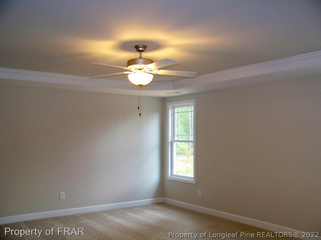160 Cashew Loop Carthage, NC 28326 - Photo 11 of 16 a view of dining room with chandelier