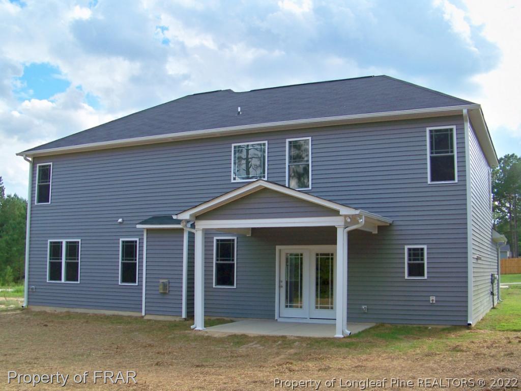 160 Cashew Loop Carthage, NC 28326 - Photo 2 of 16 a front view of a house with a yard