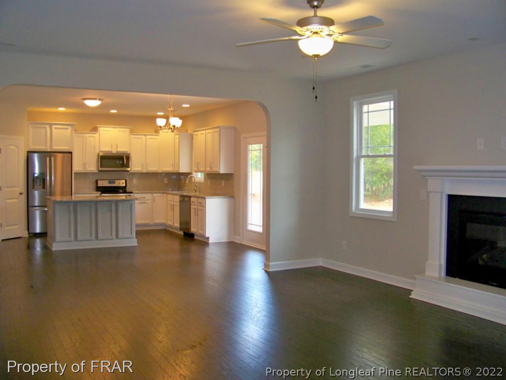 160 Cashew Loop Carthage, NC 28326 - Photo 3 of 16 a view of a kitchen with a sink and a fireplace
