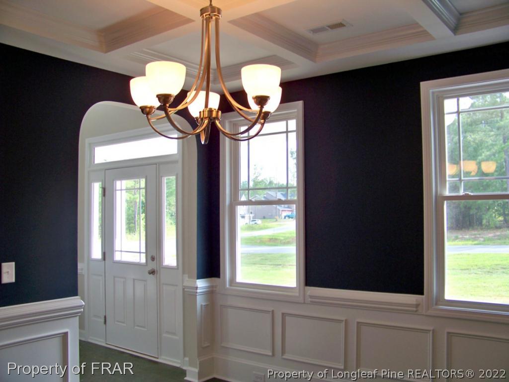 160 Cashew Loop Carthage, NC 28326 - Photo 4 of 16 a view of a room that has a window and chandelier