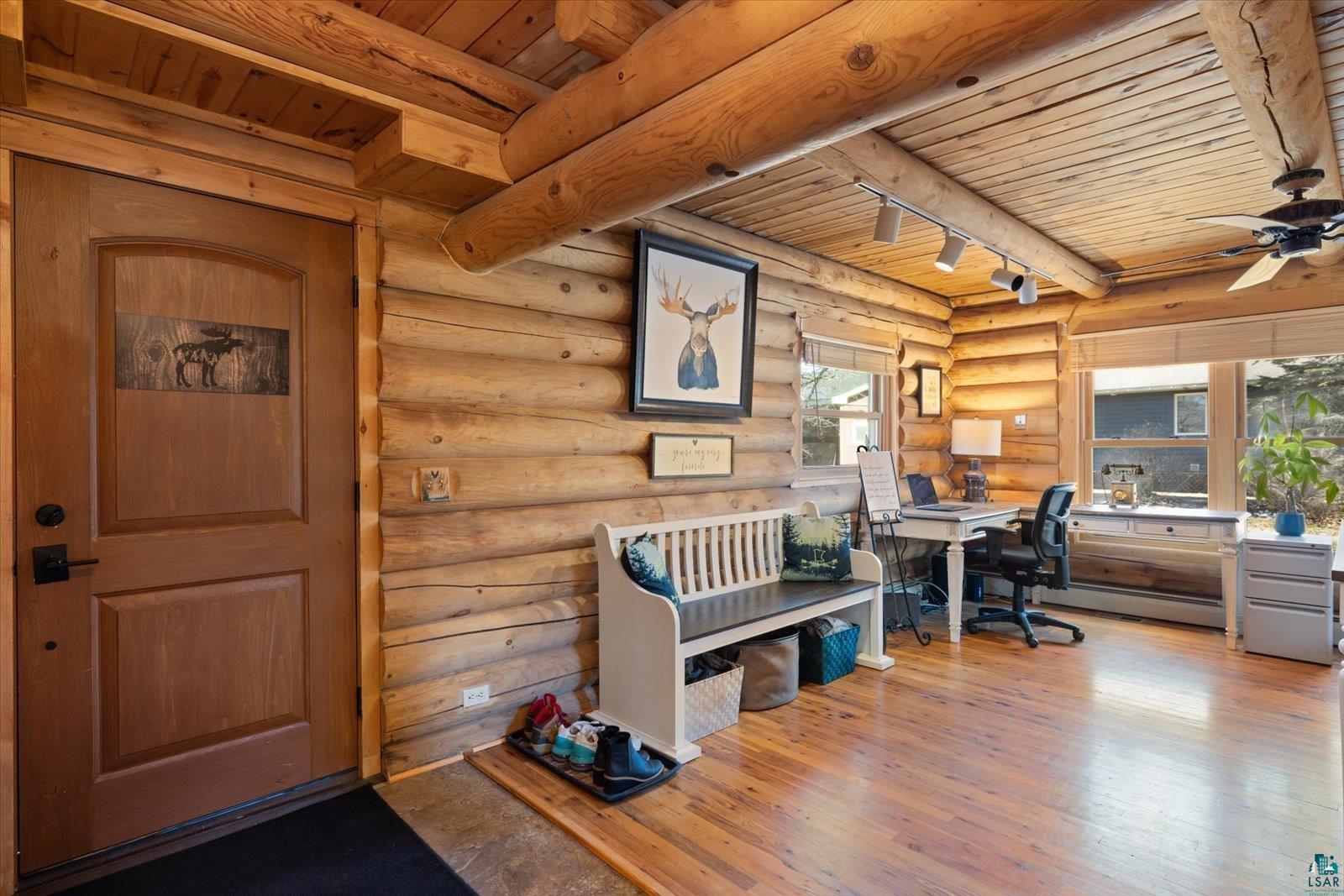 717 Bourgin Road Virginia, MN 55792 - Photo 2 of 47 Office with wooden ceiling, a ceiling fan, wood finished floors, log walls, and beamed ceiling