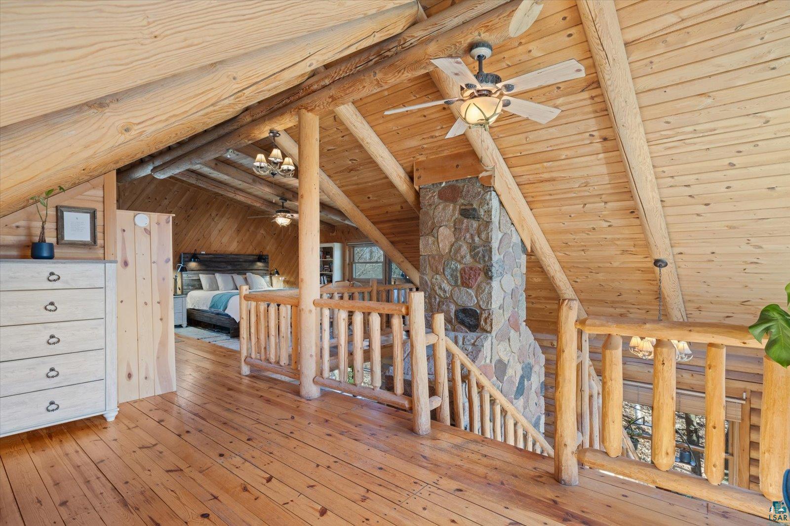 717 Bourgin Road Virginia, MN 55792 - Photo 24 of 47 Hall featuring an upstairs landing, wooden ceiling, and hardwood / wood-style flooring