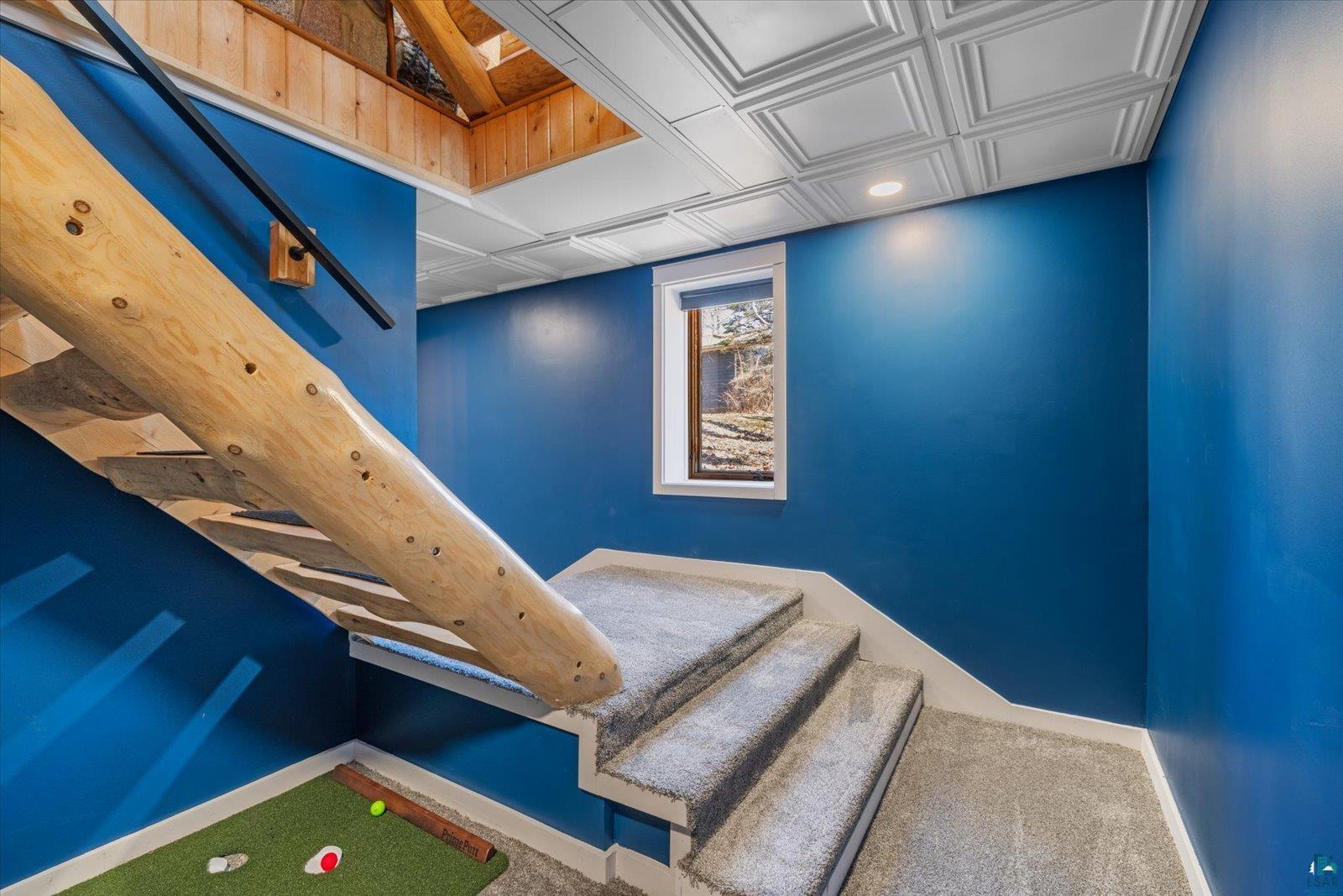 717 Bourgin Road Virginia, MN 55792 - Photo 33 of 47 Stairway with baseboards, carpet floors, and an ornate ceiling